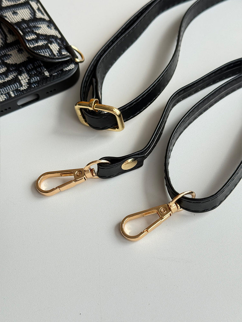 Schwarze Handyhülle mit Kartenfach, geometrischem Muster und goldfarbenem Ring
