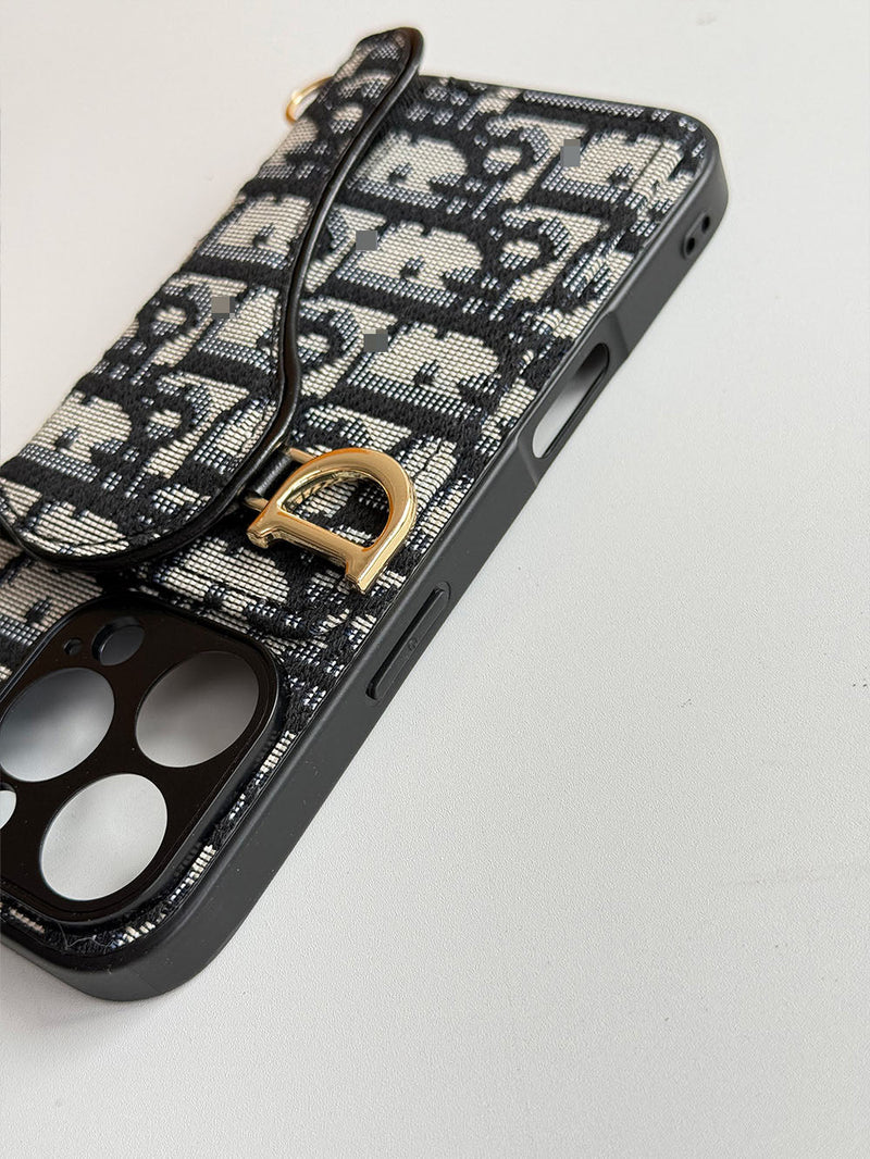 Schwarze Handyhülle mit Kartenfach, geometrischem Muster und goldfarbenem Ring