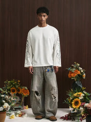 Oversize-Langarmshirt mit geschwungenem Alphabet-Schriftzug an den Ärmeln