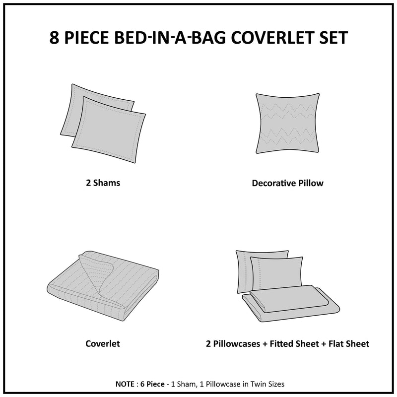 Graues Steppdecken-Set mit geometrischem Kreismuster auf einem Bett