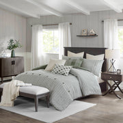 8-teiliges Bettdecken-Set mit gestreiftem Jacquard-Muster auf einem Bett