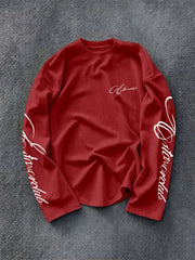 Langarmshirt mit Rundhalsausschnitt und Schriftzug auf den Ärmeln