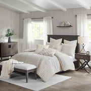 8-teiliges Bettdecken-Set mit gestreiftem Jacquard-Muster auf einem Bett