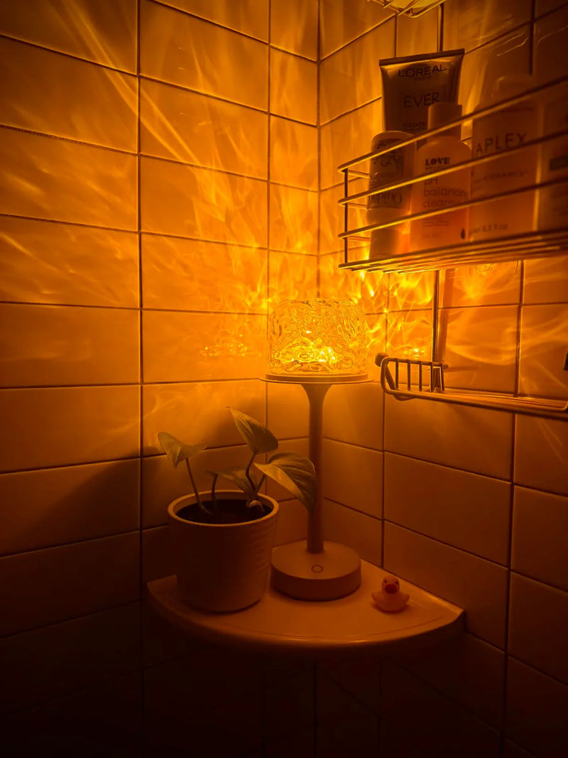 Kabellose beige Tischlampe mit warmem Aurora-Lichteffekt und rundem Standfuß