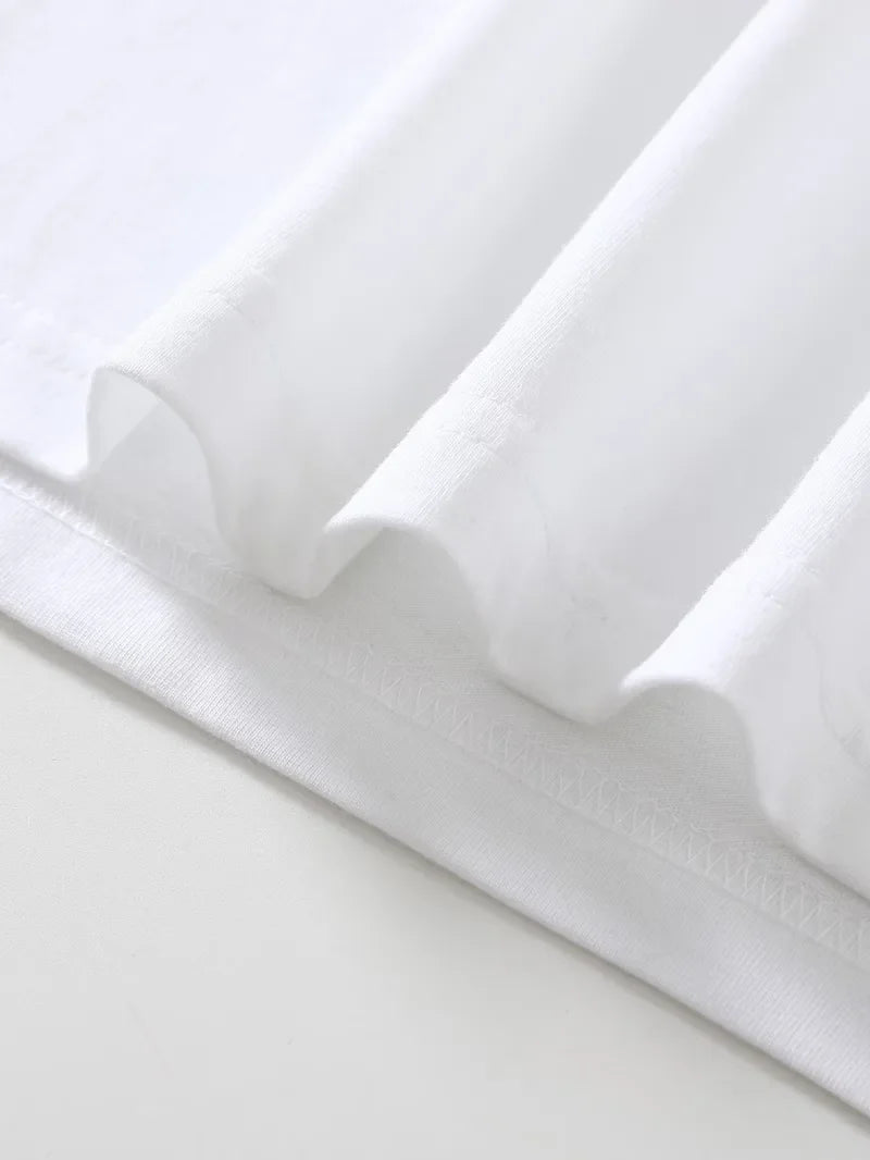 Langarmshirt mit Rundhalsausschnitt und kursiven schwarzen Schriftzügen