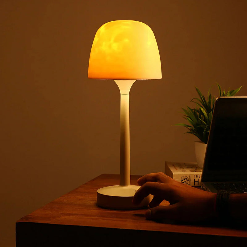 Kabellose beige Tischlampe mit warmem Aurora-Lichteffekt und rundem Standfuß