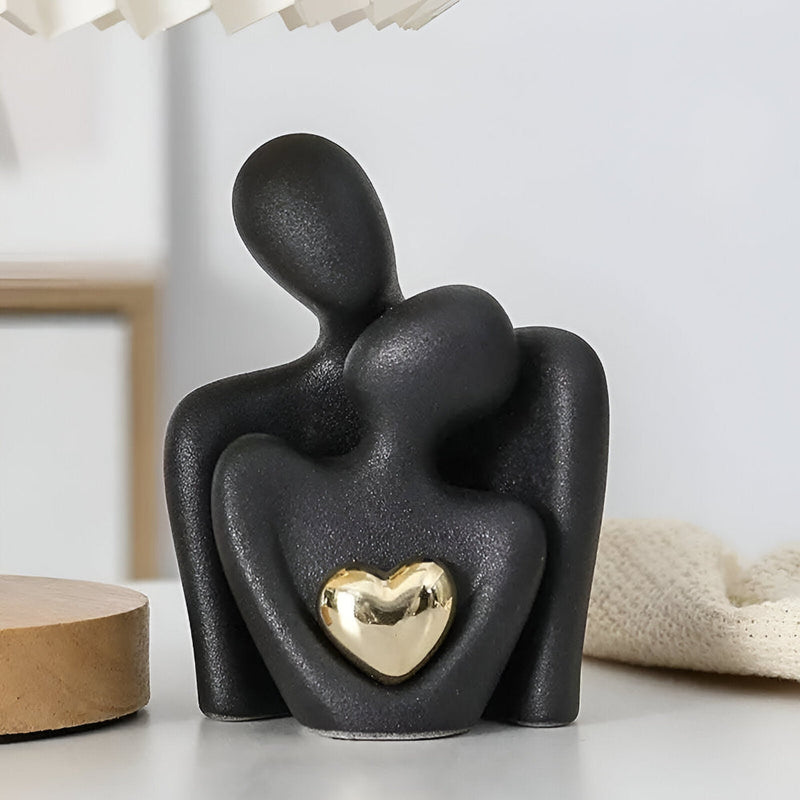 Stilisierte Paarfiguren aus Keramik mit glänzendem Herzdetail