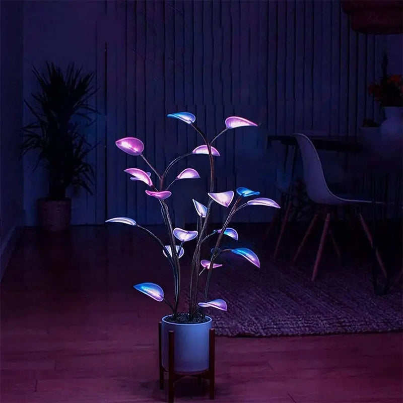 Dekorative LED-Pflanze mit leuchtenden Blättern im weißen rechteckigen Topf